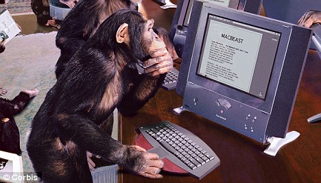 A humor Image of a monkey looking at a computer screen.